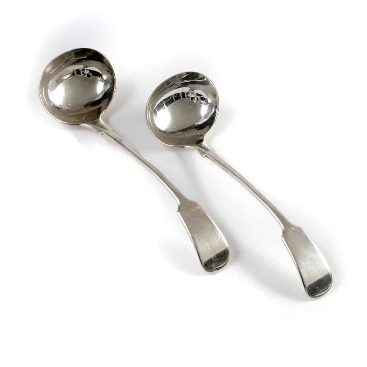 Pair of silver sauce ladles - by Robert William Jay