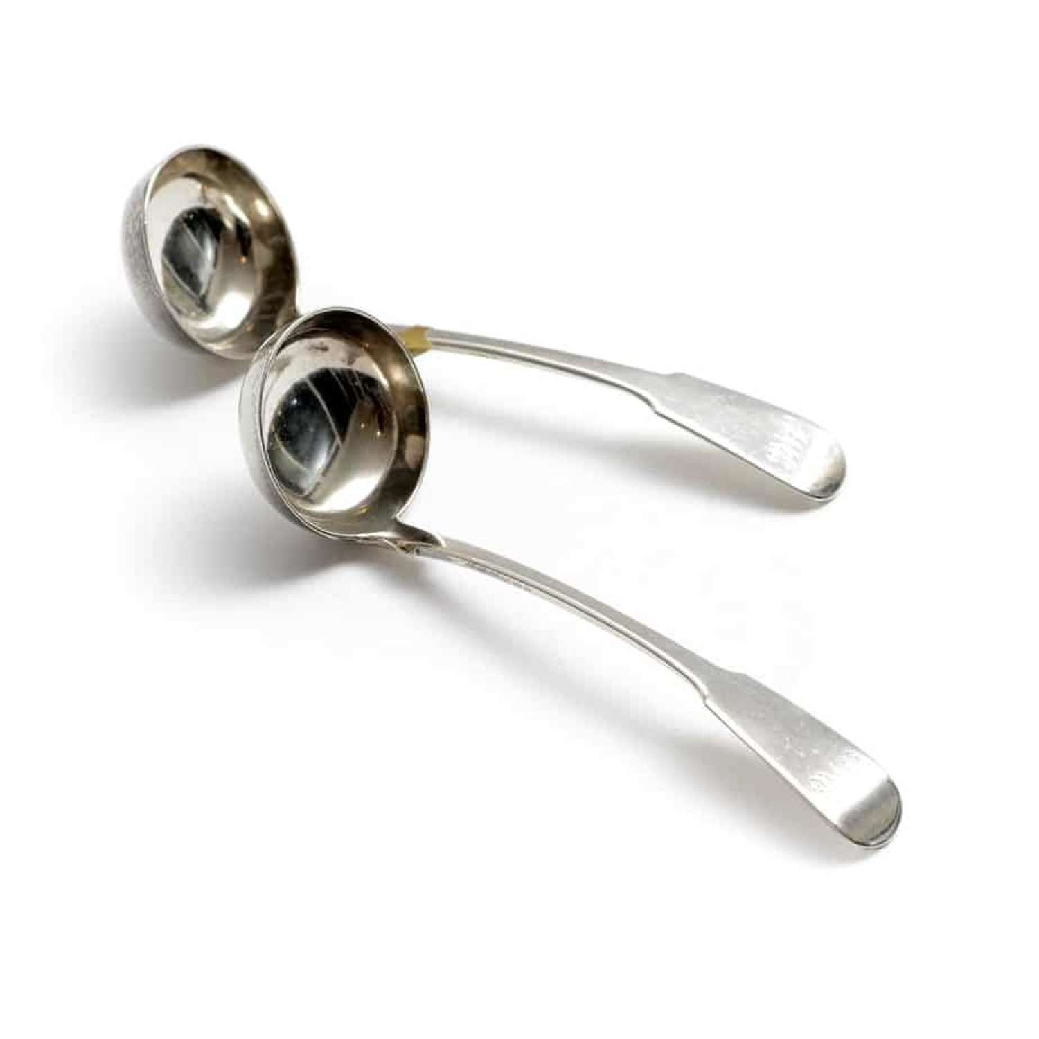 A pair of Scottish silver toddy ladles - by James McKay