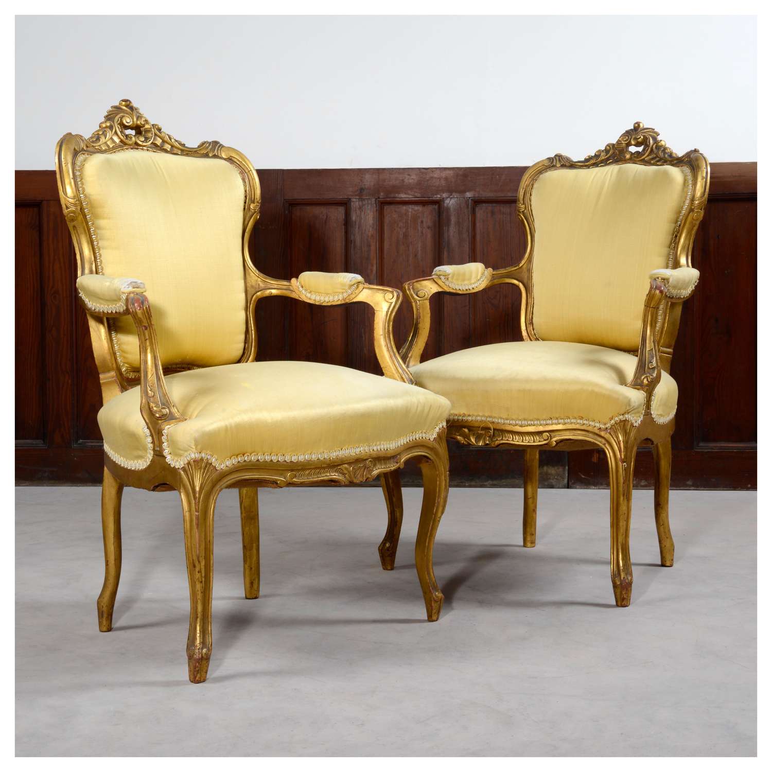 Pair of French Louis XV style gilt armchairs, or fauteuils