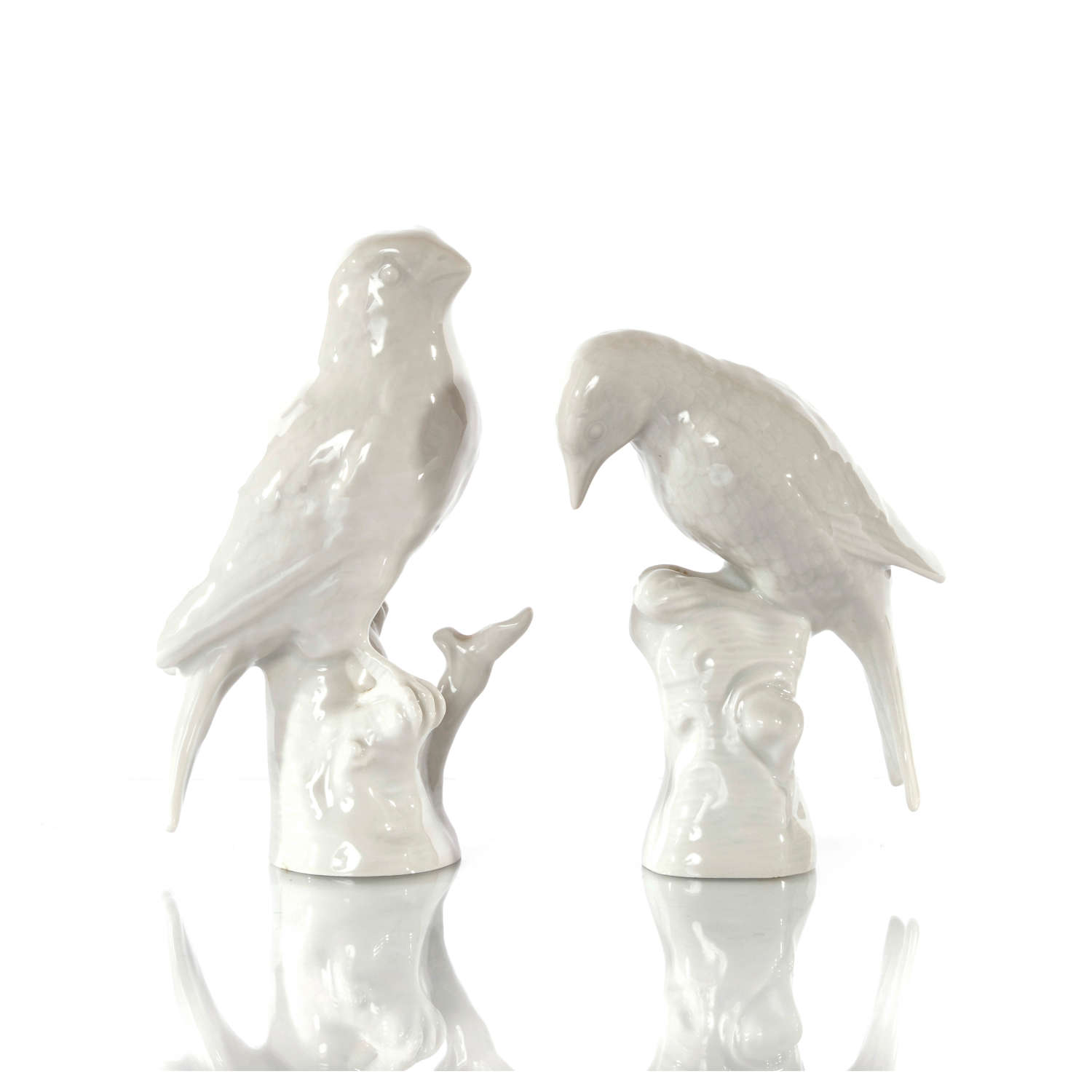 A pair of Berlin (KPM) Blanc de Chine birds, early 20th Century.