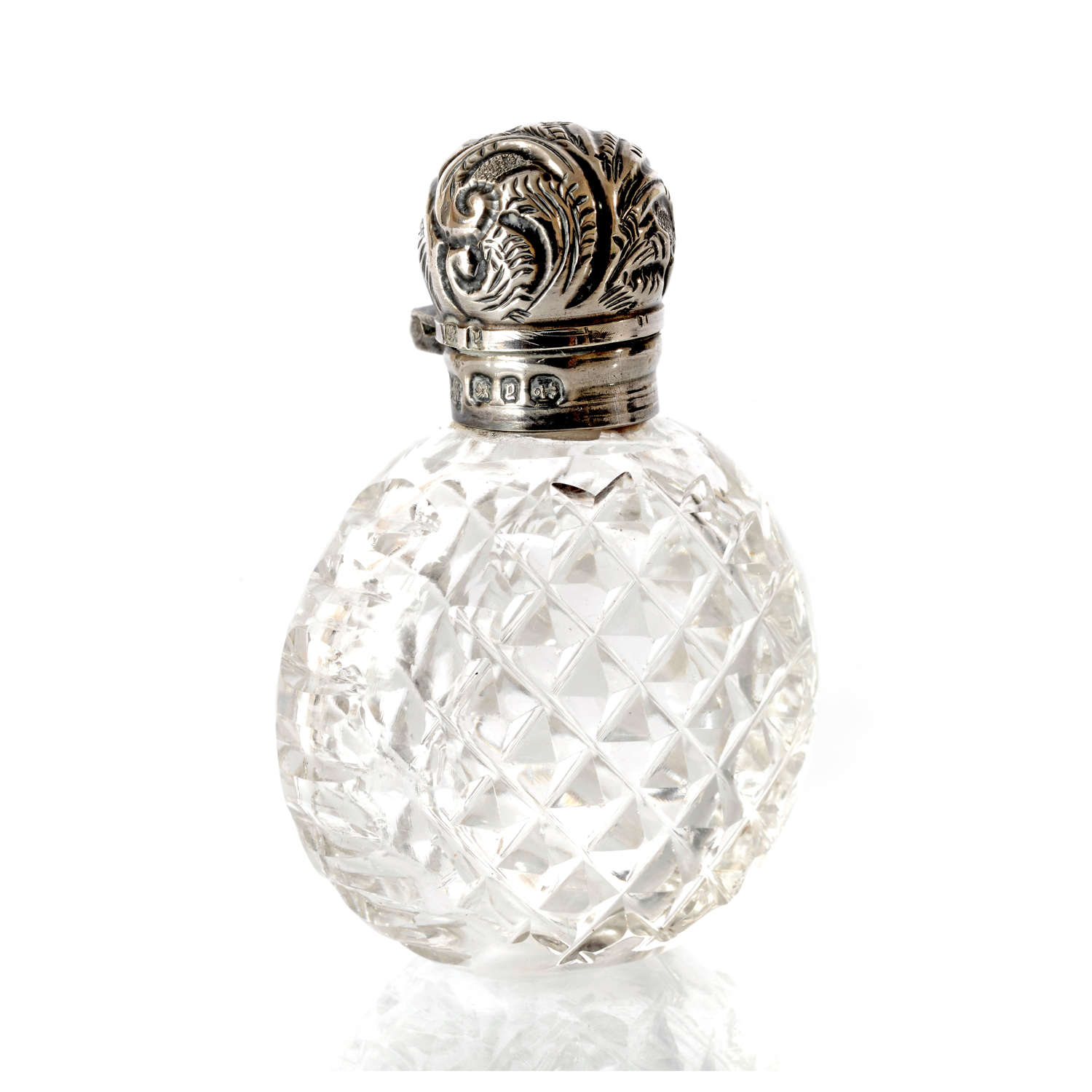 A charming Victorian small round scent bottle with silver lid.