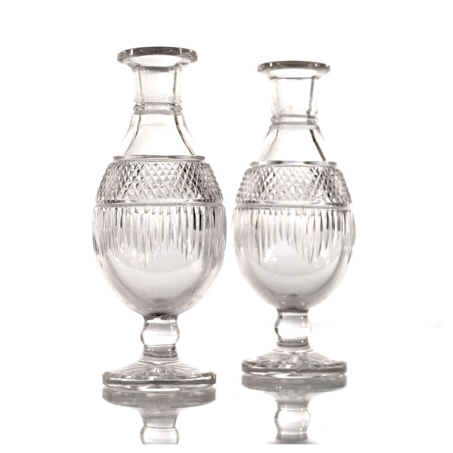 A charming pair of Regency miniature cut glass vases.