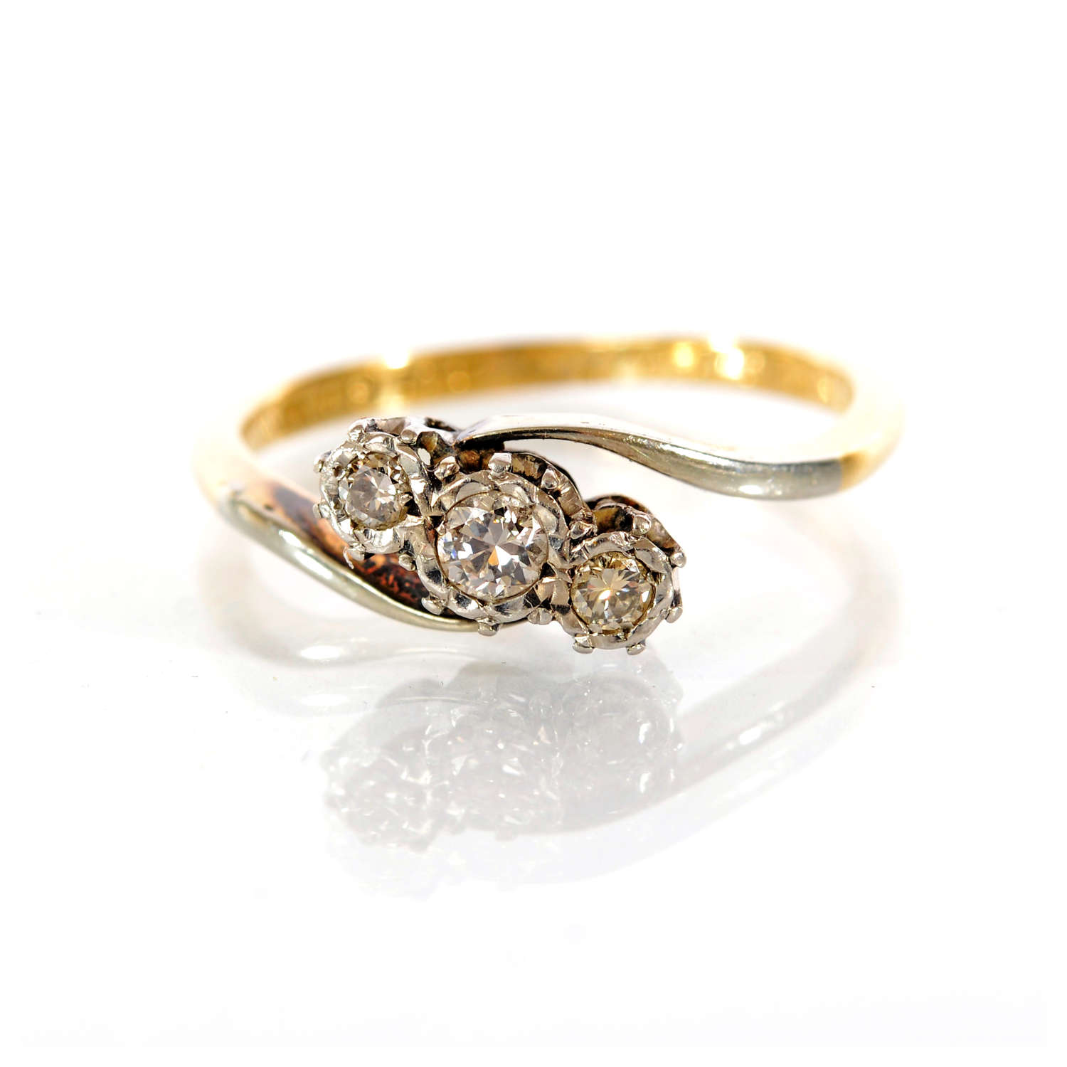 An 18ct gold and diamond three-stone.