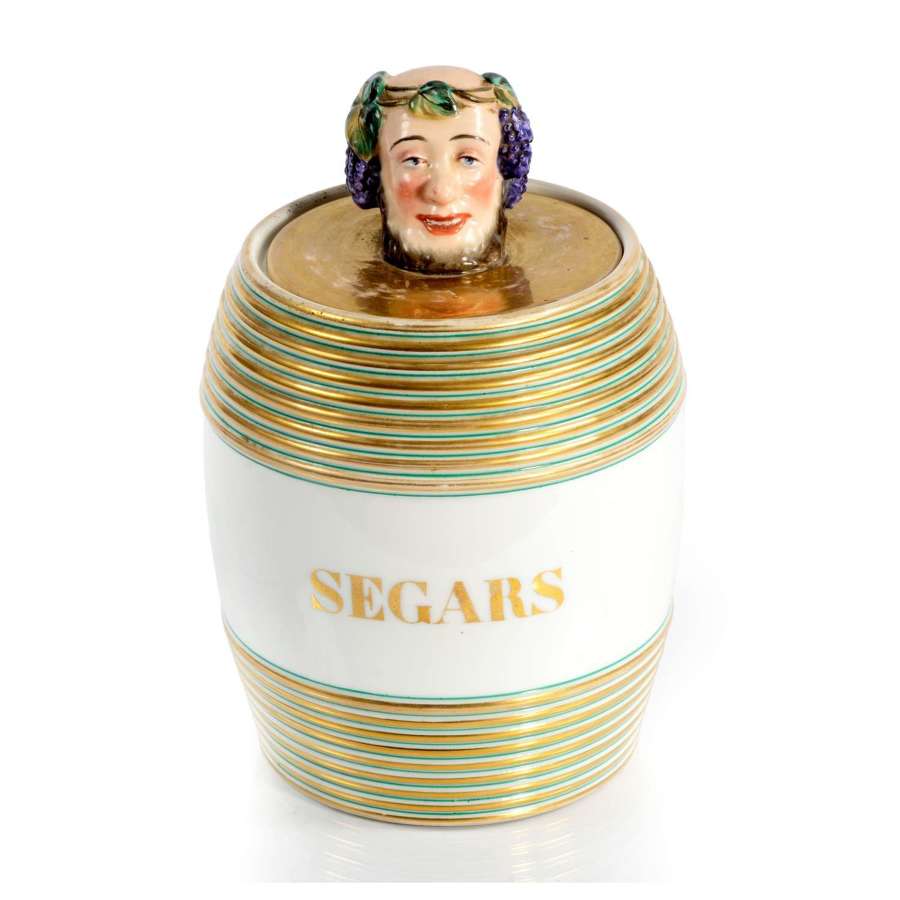 An amusing Victorian ceramic cigar barrel