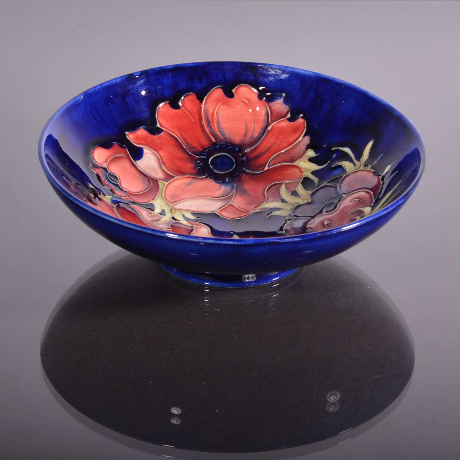 Moorcroft bowl with red anemones