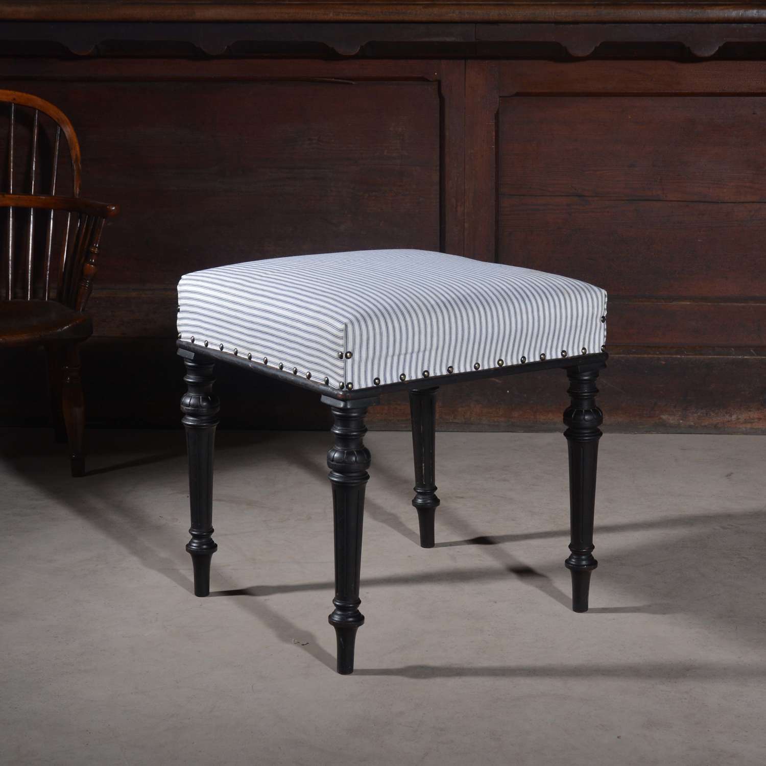 Ebonised upholstered stool
