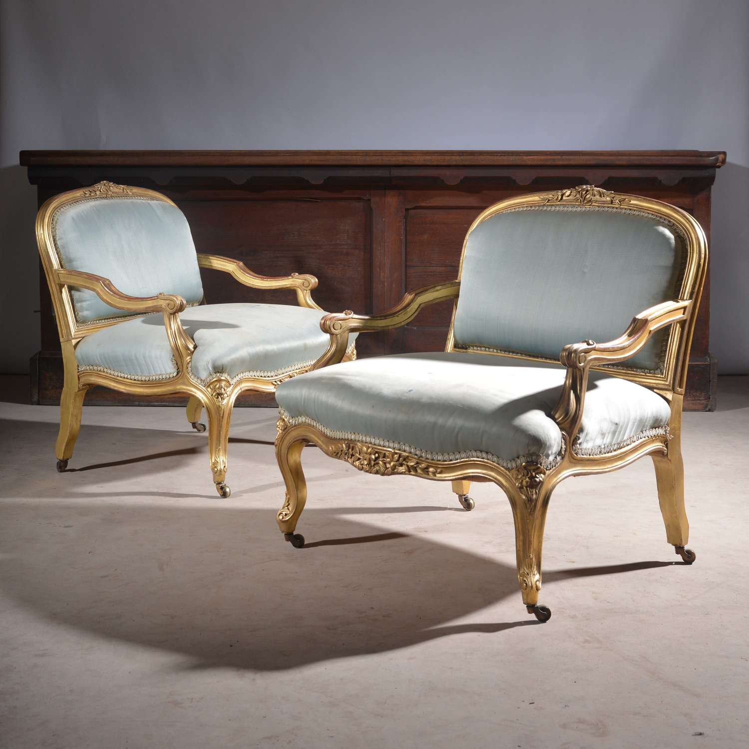 Pair of Low French Louis XV Style Gilt Armchairs