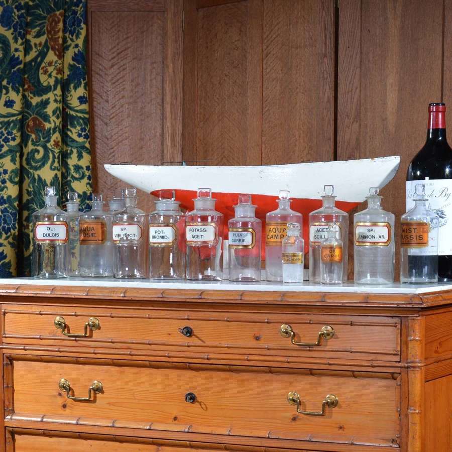 A collection of 14 apothecary bottles